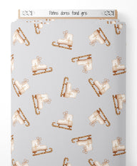 Tissu - Patins dorés sur fond gris