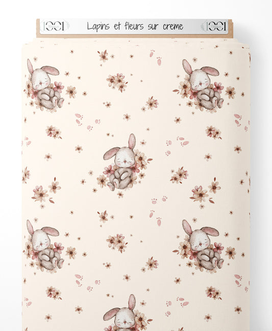 Tissu - Lapins et fleurs sur crème