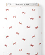 Tissu - Noeuds roses sur blanc