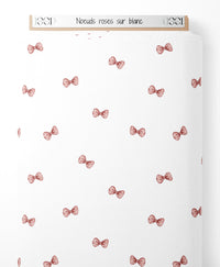 Tissu - Noeuds roses sur blanc