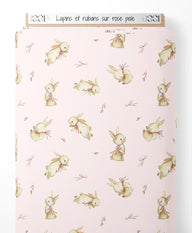 Tissu - Lapins et rubans sur rose pâle