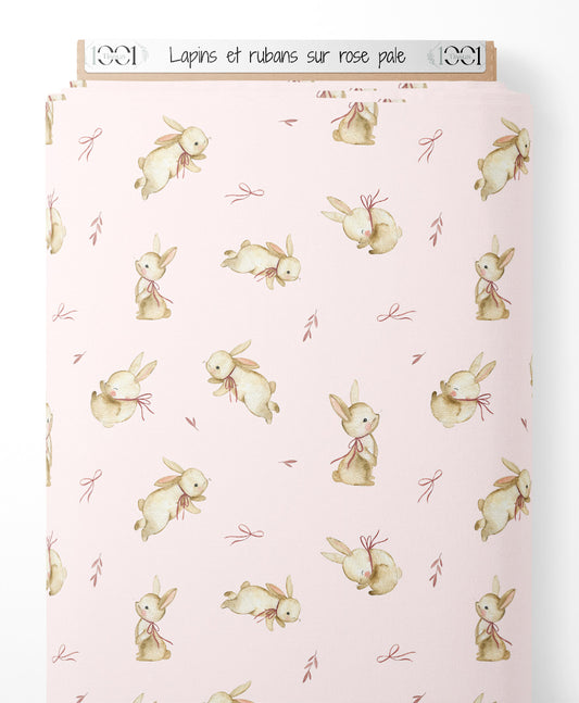 Tissu - Lapins et rubans sur rose pâle