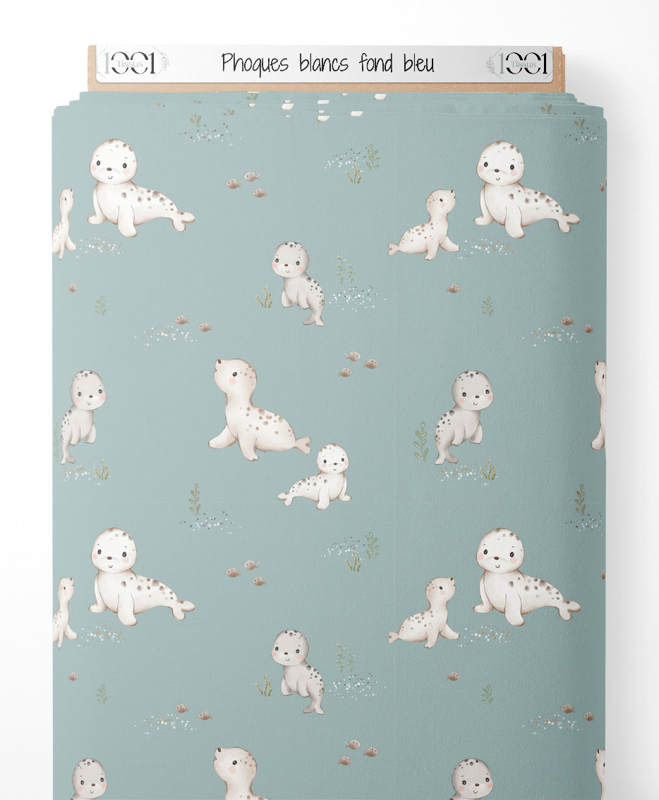Tissu - Phoques blancs sur fond bleu