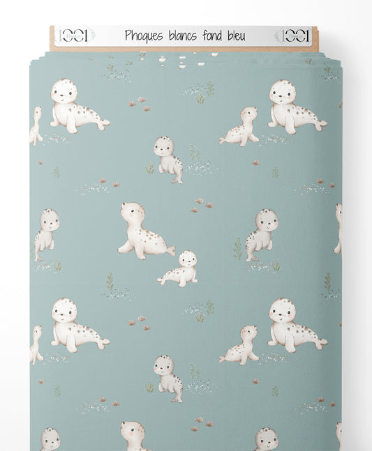Tissu - Phoques blancs sur fond bleu