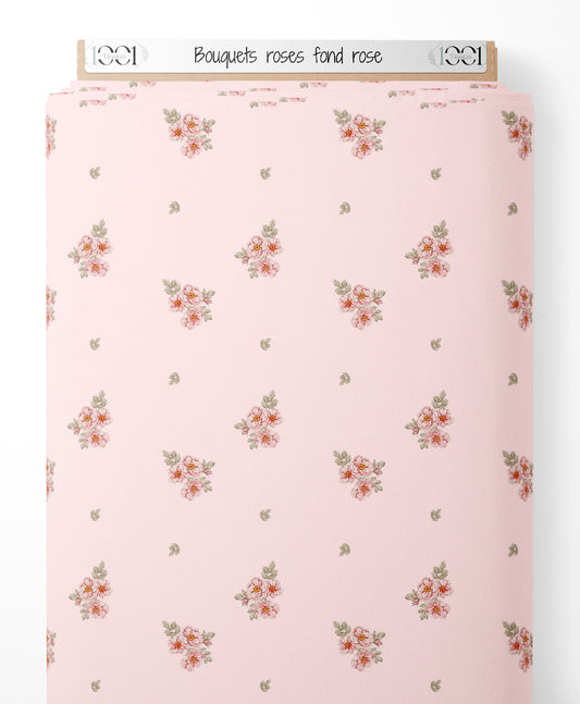 Tissu - Bouquets roses sur fond rose