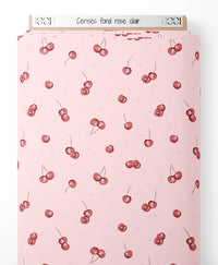 Tissu - Cerises sur fond rose clair