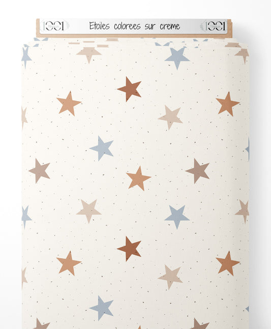 Tissu - Étoiles colorées sur crème