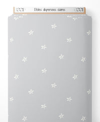 Tissu - Étoiles dispersées claires