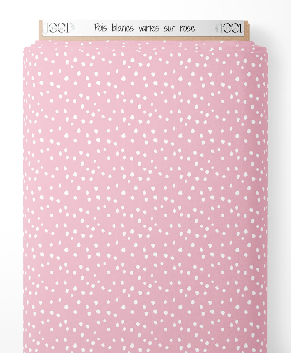 Tissu - Pois blancs variés sur rose