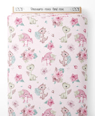 Tissu - Dinosaures roses sur fond rose