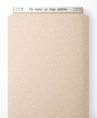 Tissu - Pois blancs sur beige uniforme