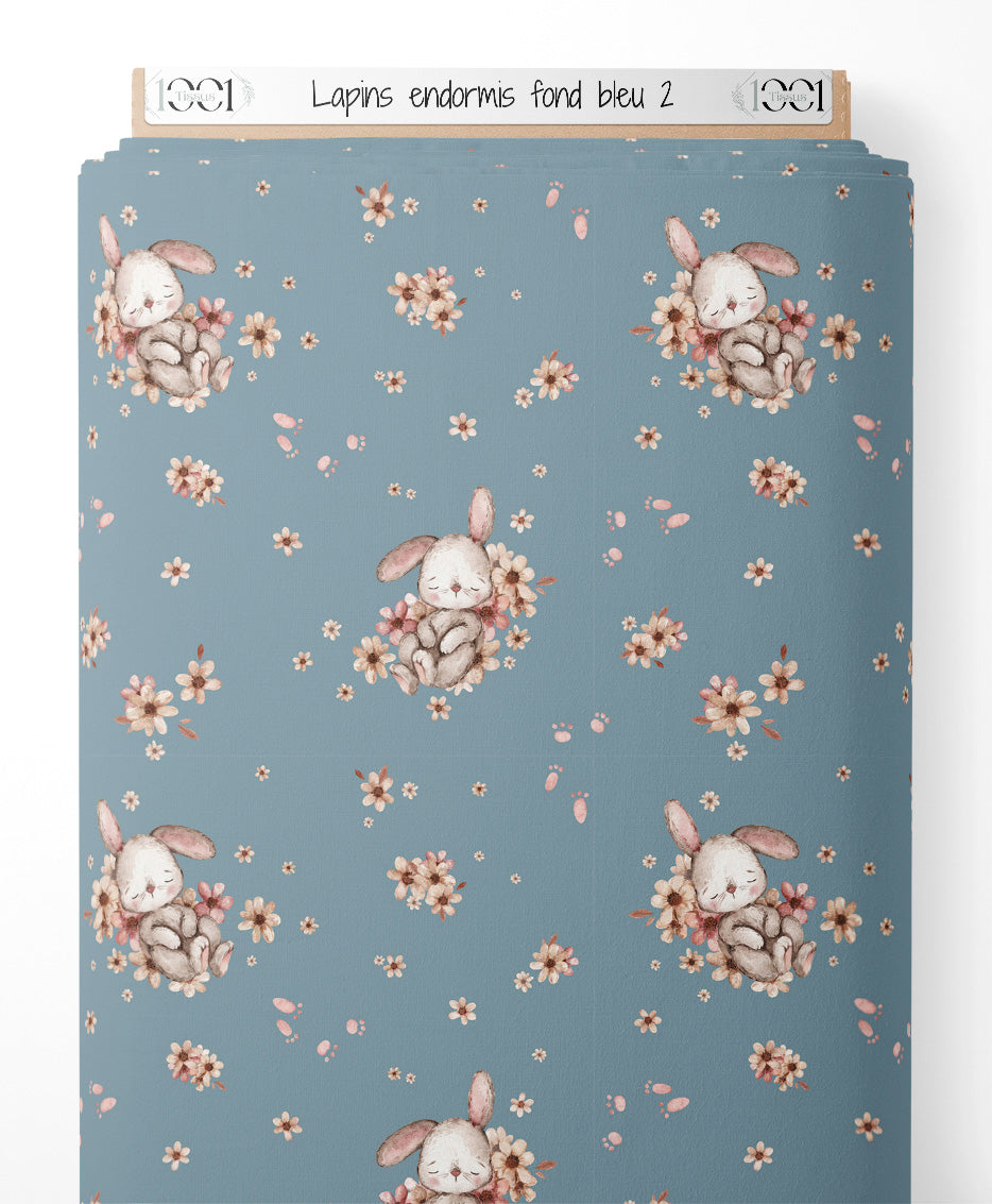 Tissu - Lapins endormis sur fond bleu 2