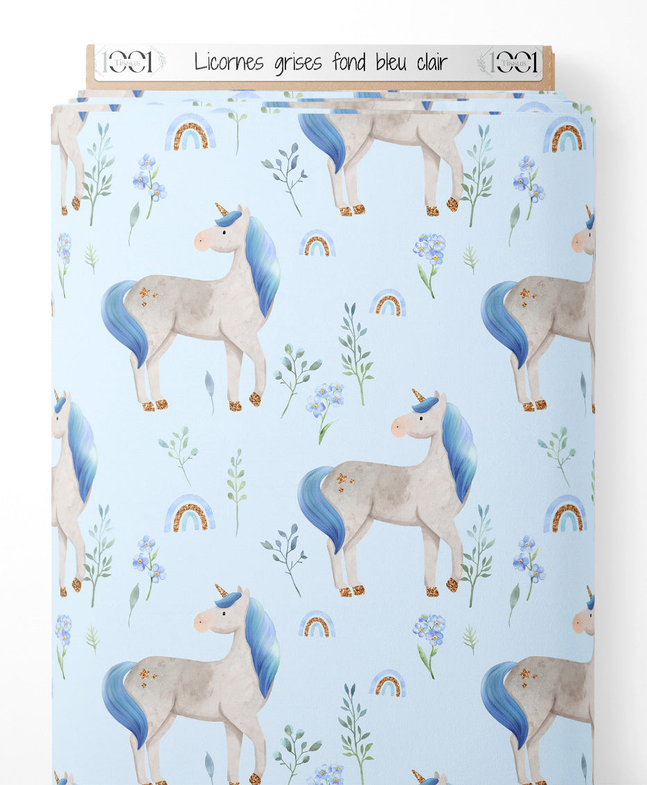 Tissu - Licornes grises sur fond bleu clair