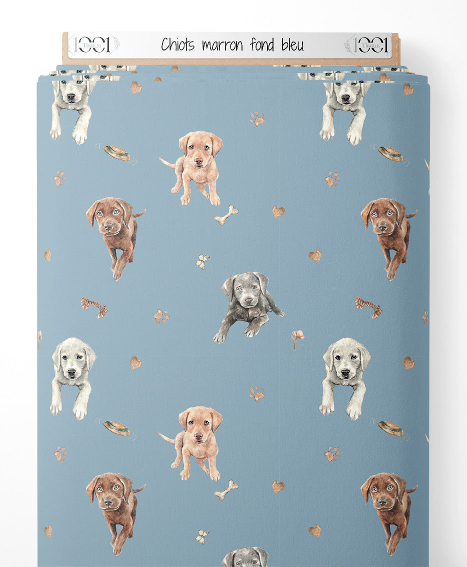 Tissu - Chiots marron sur fond bleu
