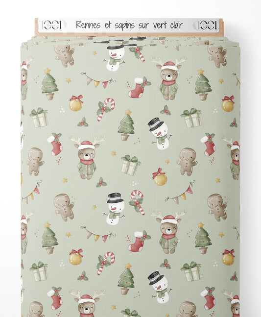 Tissu - Rennes et sapins sur vert clair
