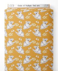 Tissu - Koalas et feuillages sur fond ocre