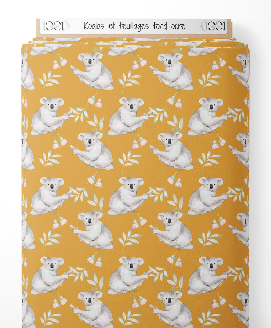 Tissu - Koalas et feuillages sur fond ocre