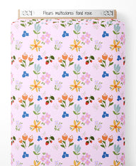 Tissu - Fleurs multicolores sur fond rose