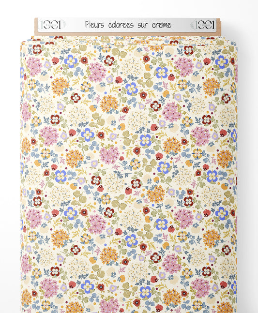 Tissu - Fleurs colorées sur crème