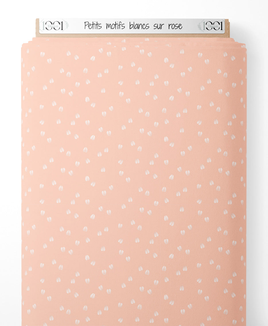 Tissu - Petits motifs blancs sur rose