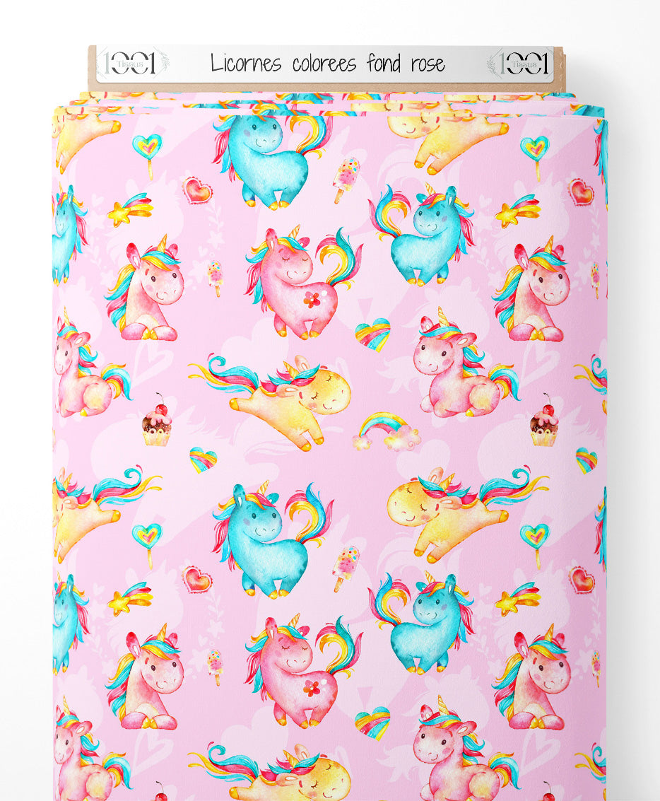 Tissu - Licornes colorées sur fond rose