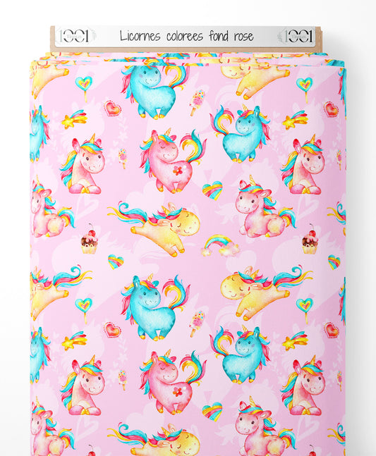 Tissu - Licornes colorées sur fond rose