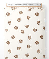 Tissu - Empreintes marron sur blanc