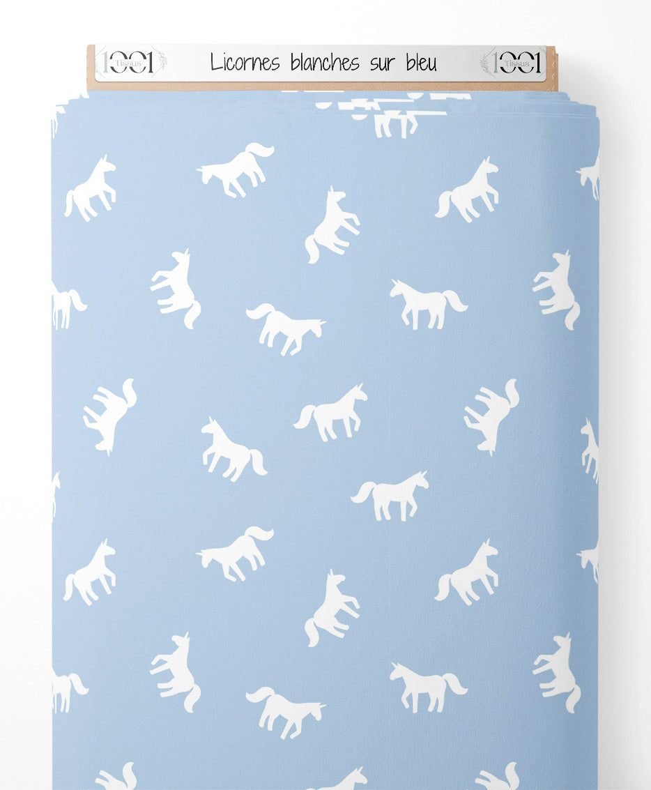 Tissu - Licornes blanches sur bleu
