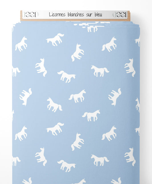 Tissu - Licornes blanches sur bleu