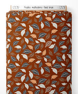 Tissu - Feuilles multicolores sur fond brun