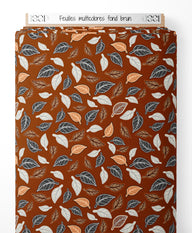 Tissu - Feuilles multicolores sur fond brun