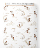 Tissu - Animaux ailés sur lunes beige