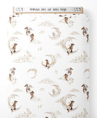 Tissu - Animaux ailés sur lunes beige