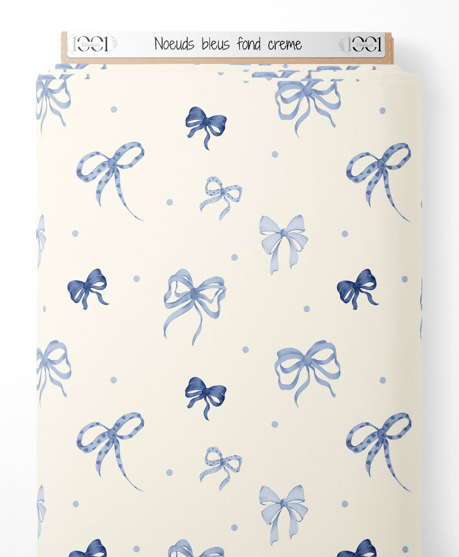 Tissu - Nœuds bleus sur fond crème