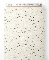 Tissu - Pois noirs variés sur crème