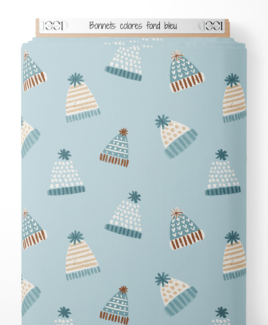 Tissu - Bonnets colorés sur fond bleu