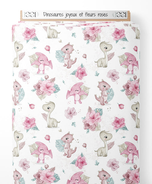 Tissu - Dinosaures joyeux et fleurs roses