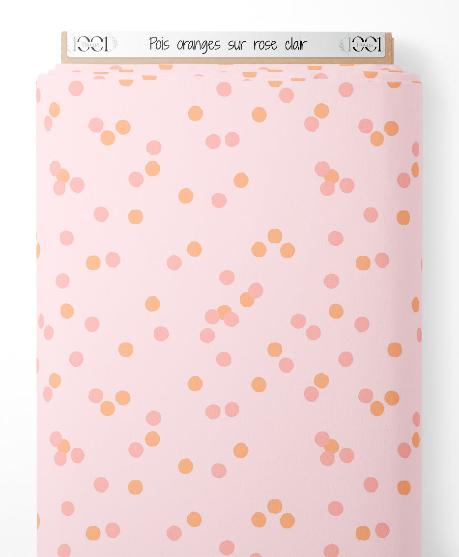 Tissu - Pois oranges sur rose clair