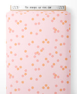 Tissu - Pois oranges sur rose clair