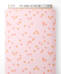 Tissu - Pois oranges sur rose clair