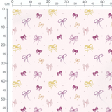 Tissu - Nœuds colorés sur fond rose