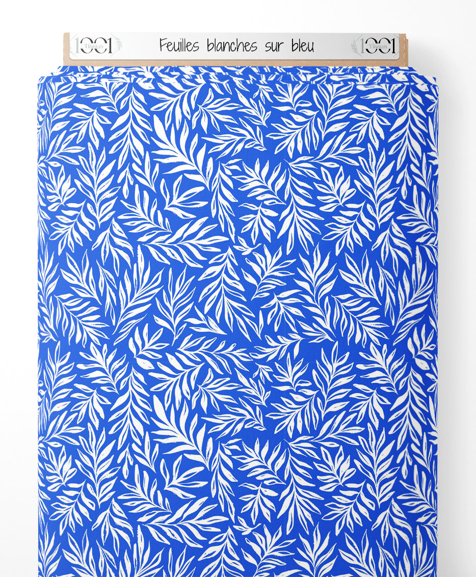 Tissu - Feuilles blanches sur bleu