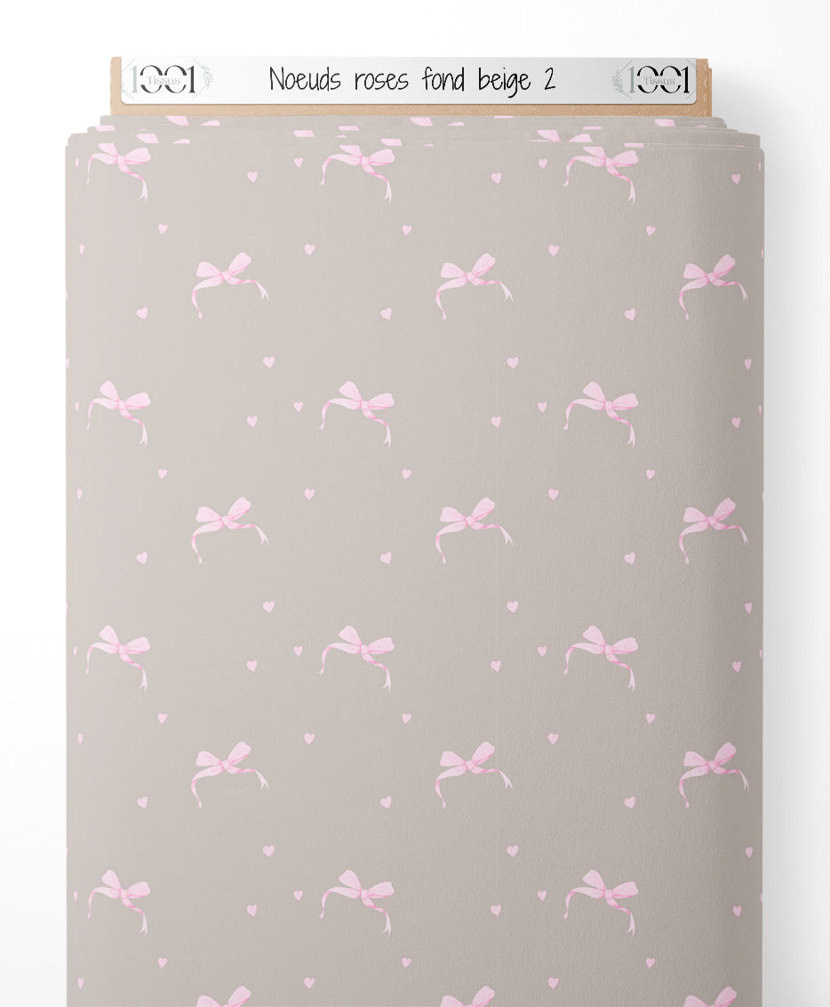 Tissu - Nœuds roses sur fond beige 2