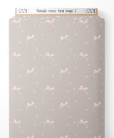 Tissu - Nœuds roses sur fond beige 2