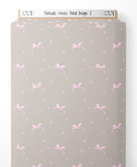 Tissu - Nœuds roses sur fond beige 2