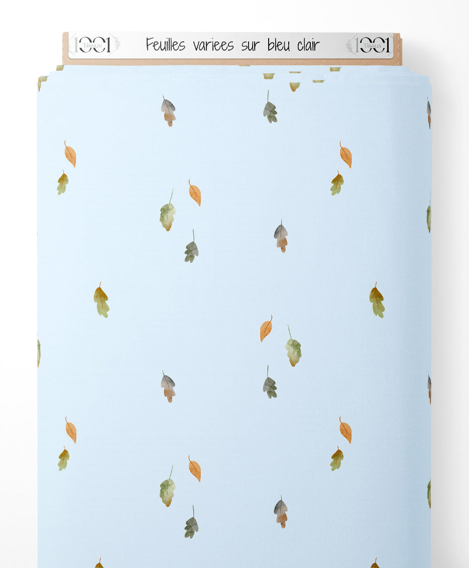 Tissu - Feuilles variées sur bleu clair