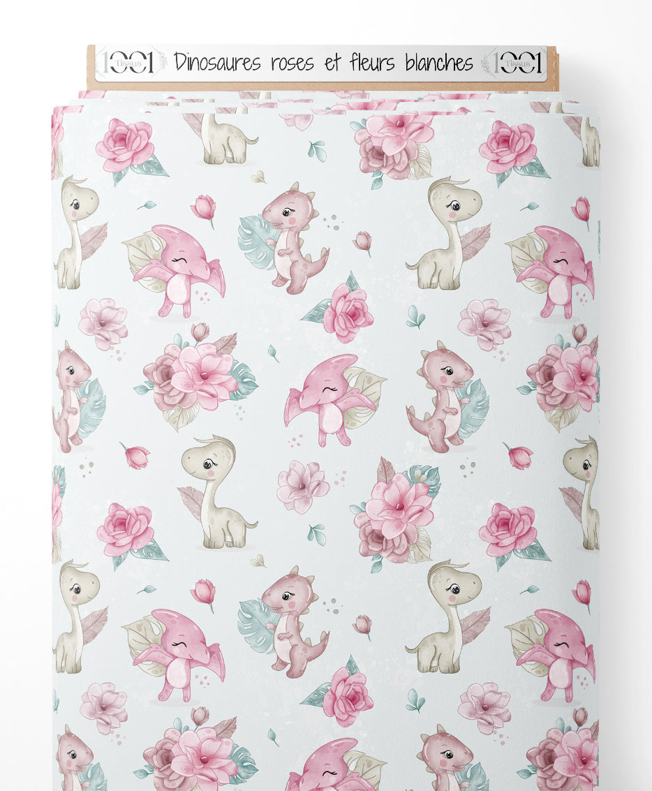 Tissu - Dinosaures roses et fleurs blanches