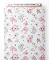 Tissu - Dinosaures roses et fleurs blanches