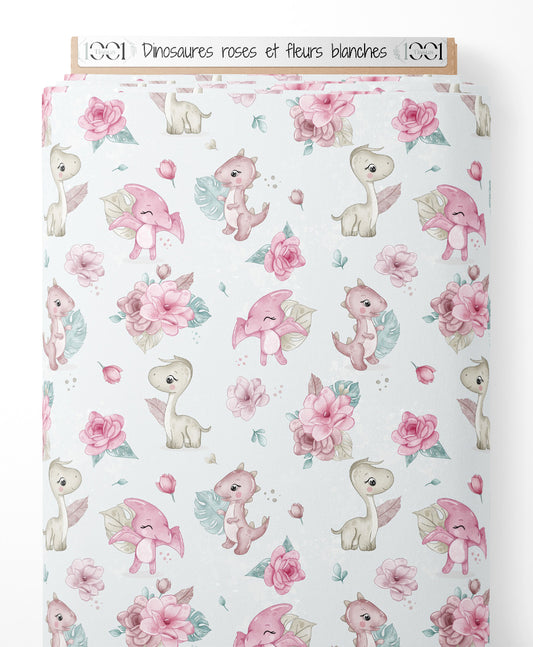 Tissu - Dinosaures roses et fleurs blanches