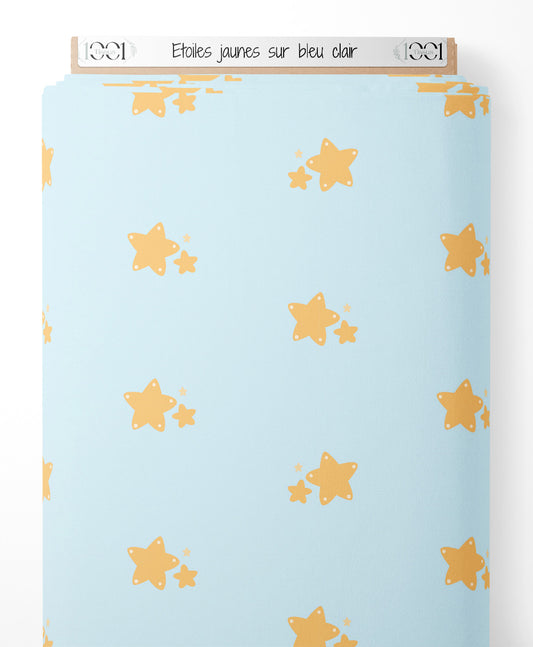 Tissu - Étoiles jaunes sur bleu clair
